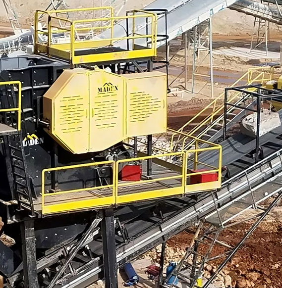 Heavy-duty jaw crusher used for crushing stones and minerals in mining and construction industries.