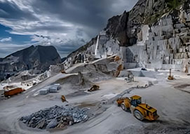Jaw crusher used in quarry mine activity for breaking down large rocks into smaller materials.